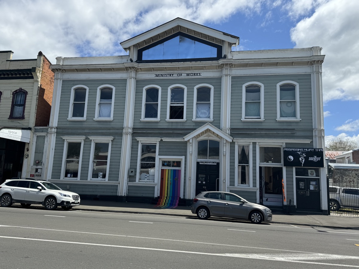 Front of the historic Ministry of Works Building on Taupo Quay, Whanganui, with its rainbow-painted entrance steps